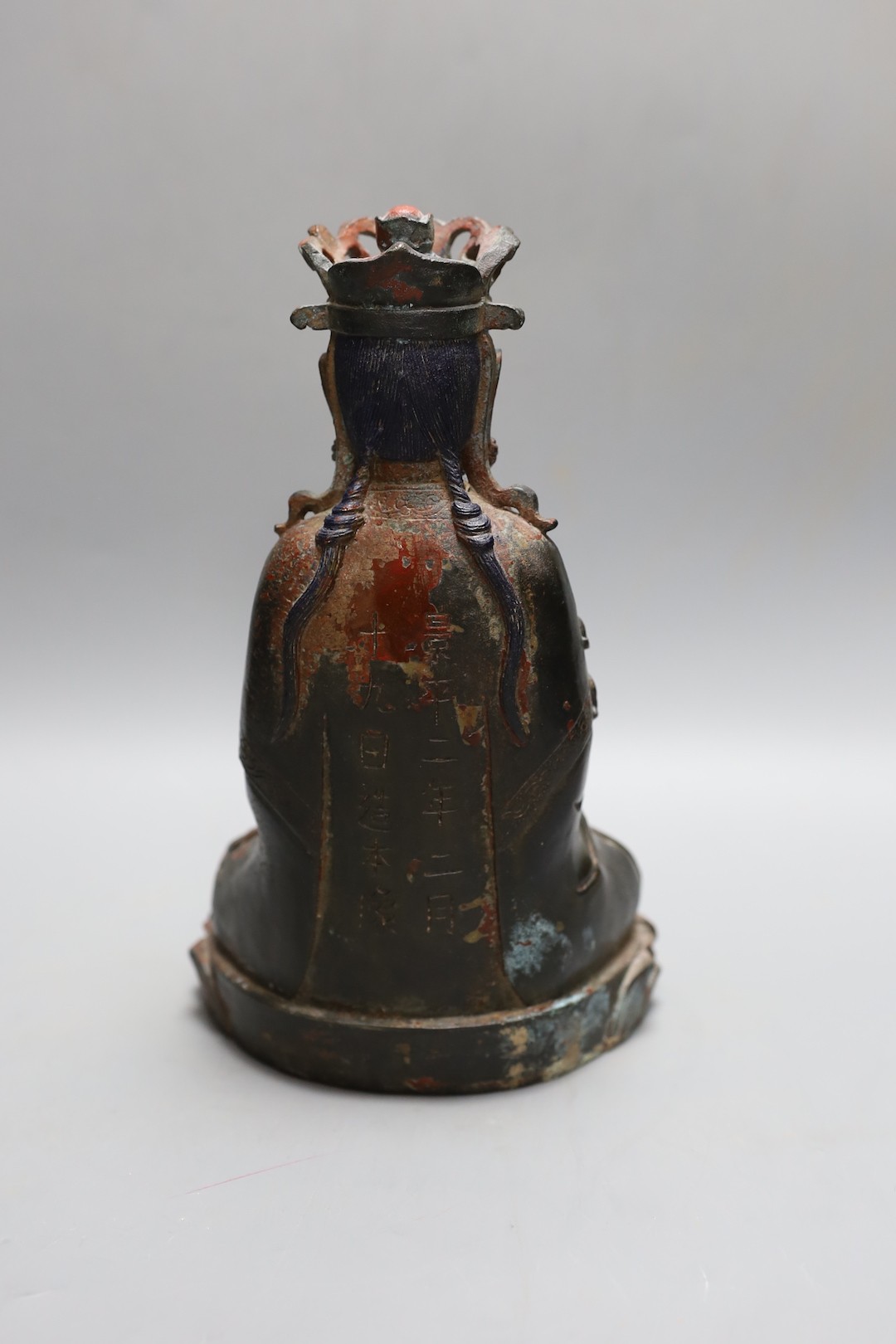 A Chinese Ming style bronze seated figure of Guanyin, 25cm